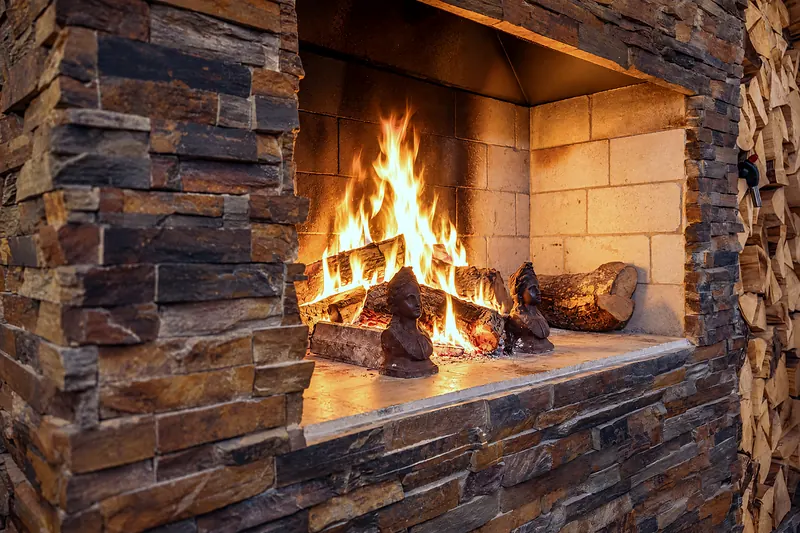 By the fireplace