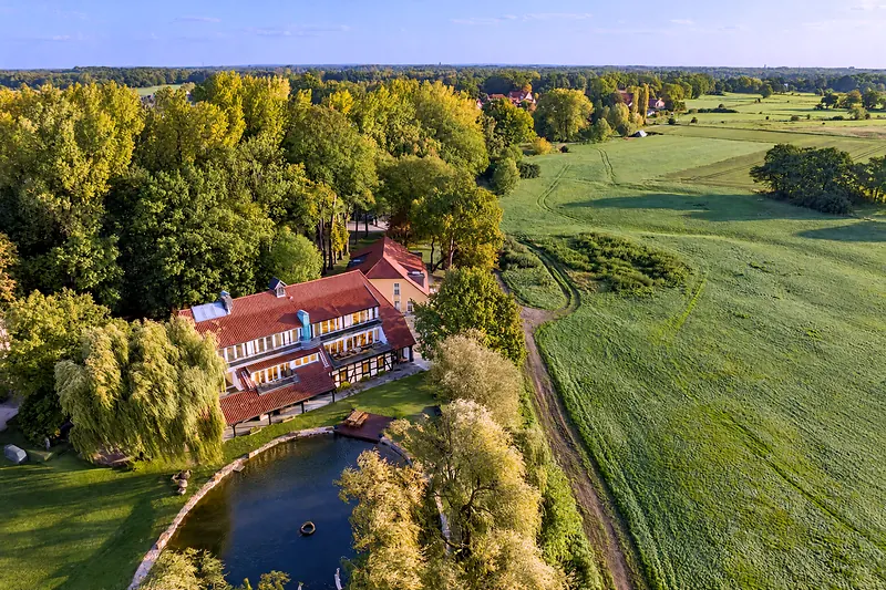 House and meadows from above